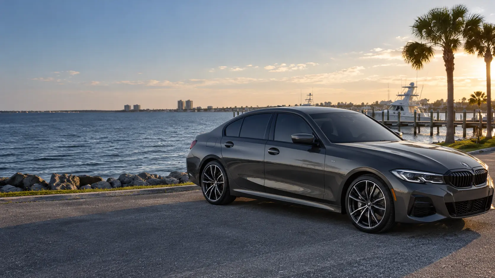 Tinted black sedan beside Pensacola Bay